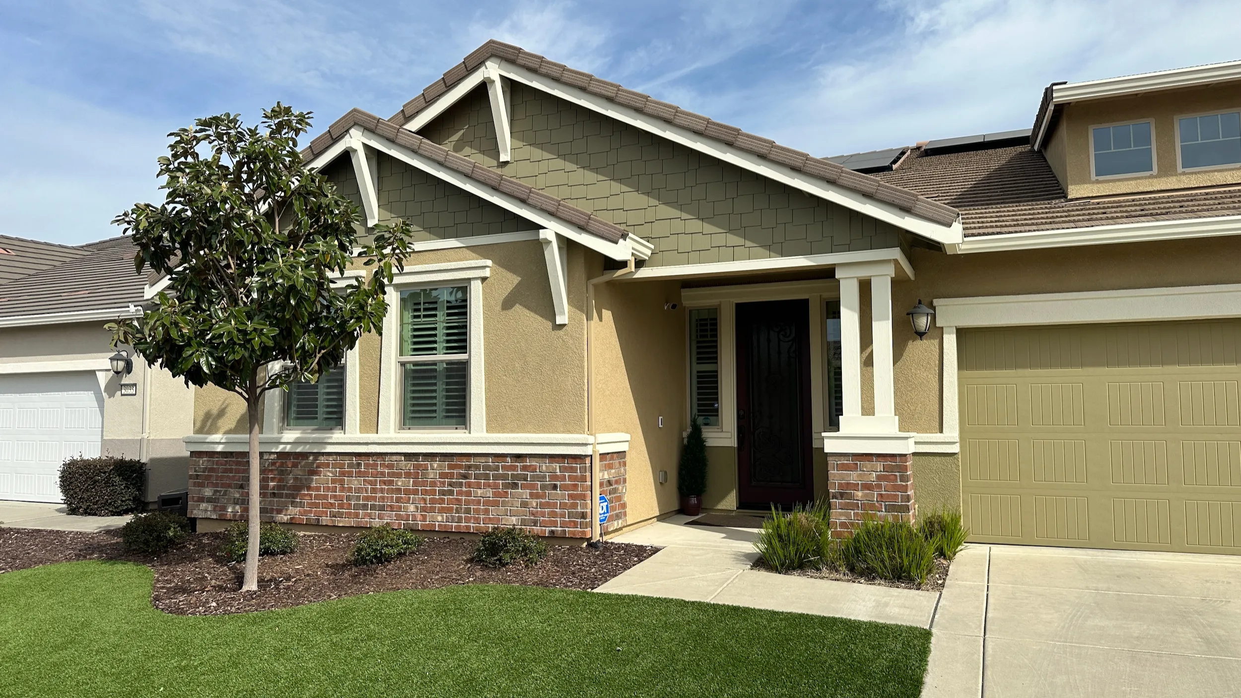 Comparison of a freshly painted house and one needing paint, highlighting the importance of quality in painting services